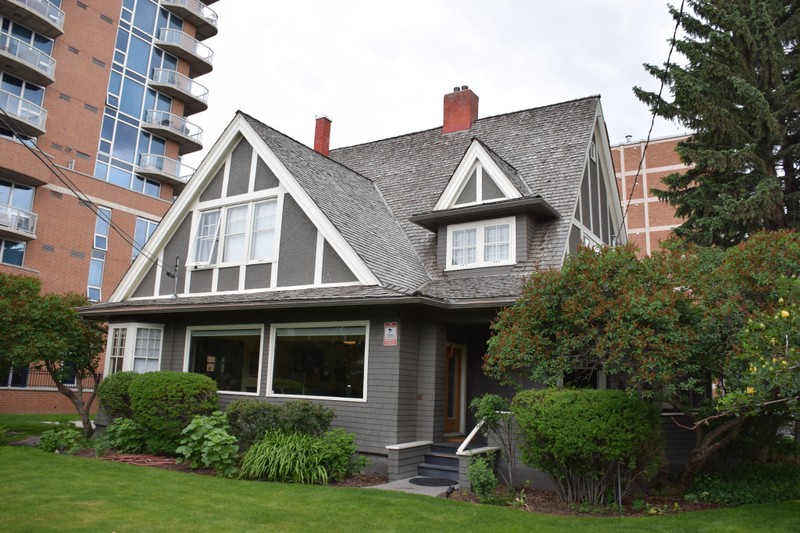 Grey wood-frame house with white trim