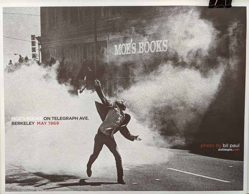 Photograph of protestor on Telegraph Ave during the People's Park protests (May 1969), showing Moe's Books in the background. This image was also made into a poster, which is sold at Moe's Books.
