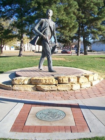 The statue is located at the corner of Central Avenue and Wyatt Earp Blvd.