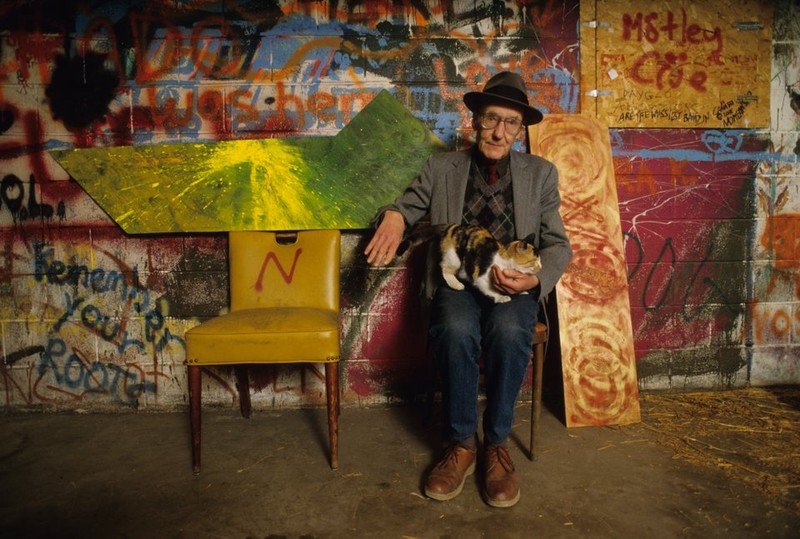 Pictured here is William S. Burroughs with his cat. The Beat Generation writer had a limited relationship with the venue, but was friendly with local musicians and promoters. He even wrote lyrics for The Micronotz debut album in 1982 and was featured on their last release in 1995.