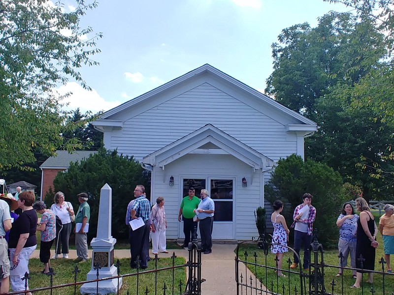 front of the New London United Methodist Church during monument dedication