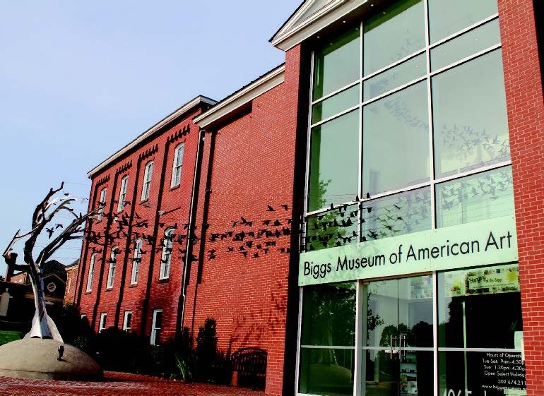 The façade of the Biggs Museum of American Art, featuring its first permanent sculptural installation, Aloft (2015), by Erica Loustau, the capstone of the museum’s 2011–2014 renovation.