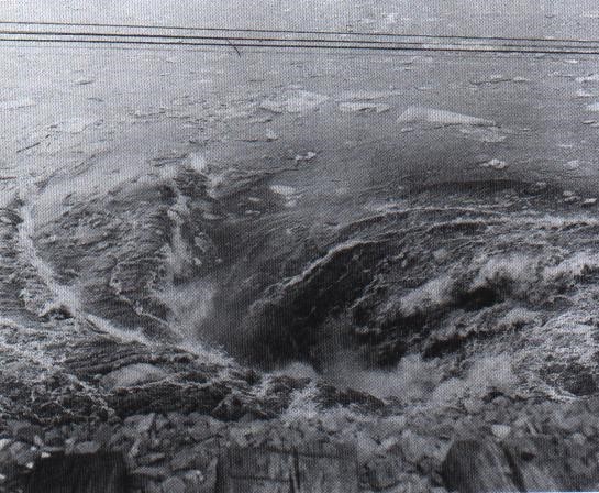 Whirlpool caused by water pouring into the mine shaft.  Photo by William R. Lukasik, copyright Lukasik Studio Archives.