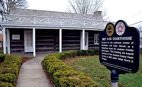 The exterior view of the log courthouse 