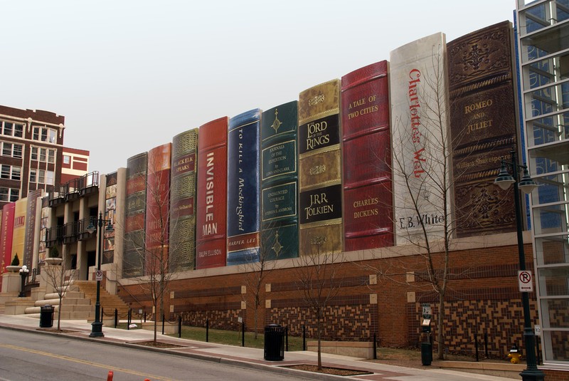 The south wall of the library's free parking garage is known as the Community Bookshelf. The wall was made by creating 25-foot book spines out of mylar signboard for each of the 22 books that were selected by community members in a 2004 contest. 