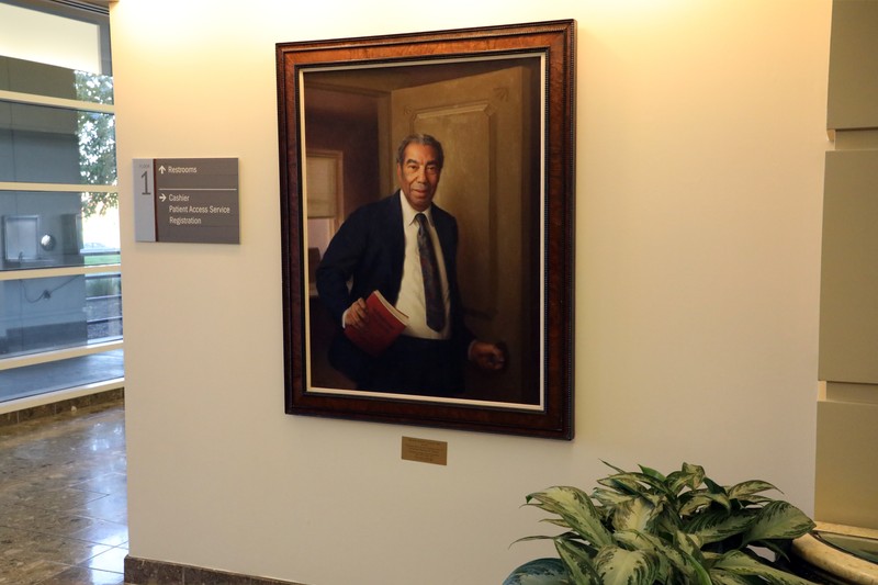 Painting of Frank Lloyd hanging in the lobby of A Building