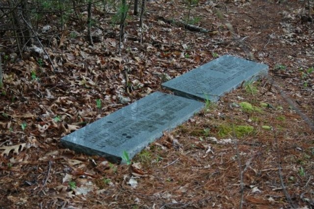 A close-up photo of the gravestones commemorating those who were killed in the massacre. 