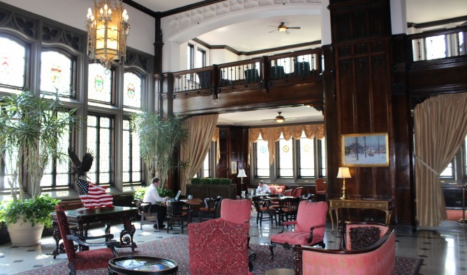 The Columbia Club's grand first floor lobby is furnished with floor-to-ceiling walnut paneling.