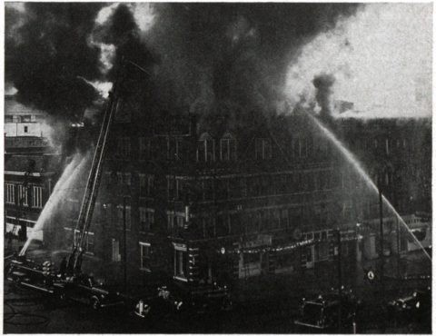 Firemen fight the fire at the Adelphia on Christmas 1950
