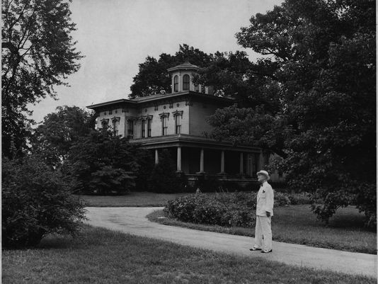 Samuel P. Jones assessing the estate for the school board in 1948 (image from the Courier-Journal)