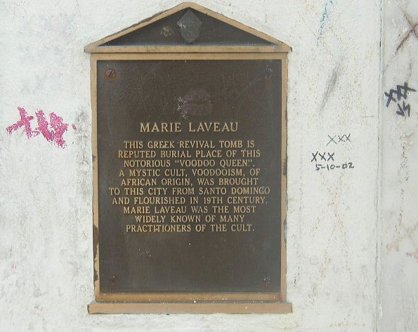 The plaque on the tomb. It tells the history of the crypt and the woman who might be inside of it.