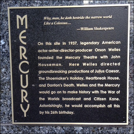 The plaque on the side of the building