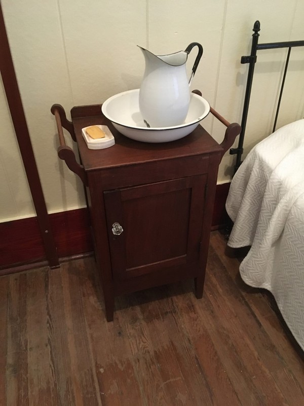 Each student would have had a bedside cupboard/night stand. Before the building was equipped with running water, clean water for washing was carried each day and emptied from the basin after use. Baths were provided once a week, with an extra expense if a family requested an additional bath per week for their daughter in the summer months.