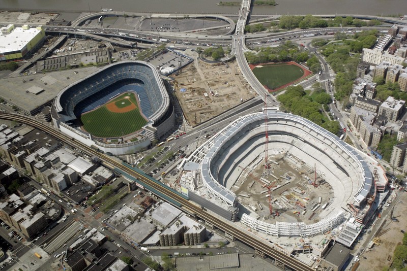 Old Yankee Stadium on the left and the construction of the New Yankee Stadium on the right. 