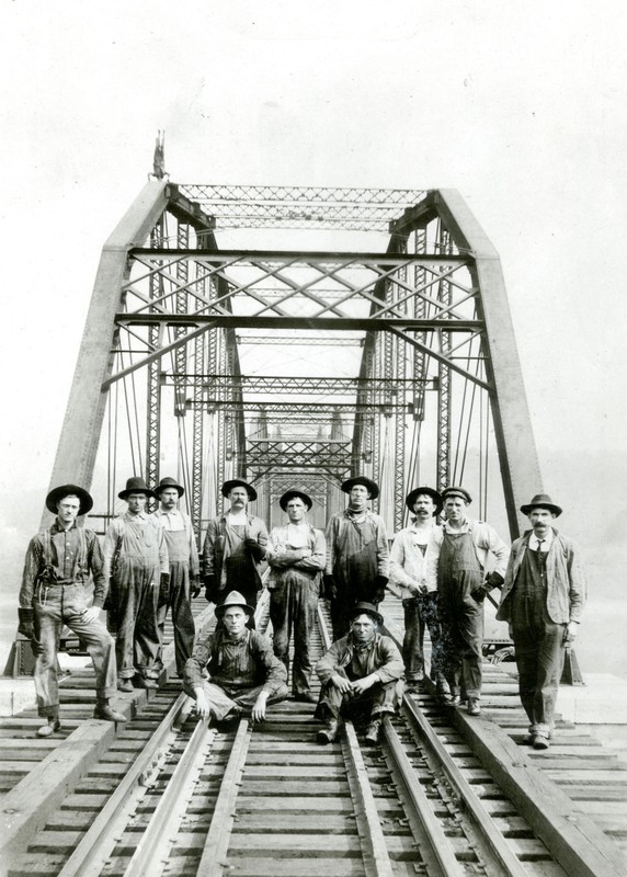 N & W workers standing on the newly competed bridge. 