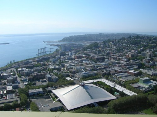 An overhead view of the city.  It showcases some of Seattle's finest architecture, including KeyArena with its curved roof.