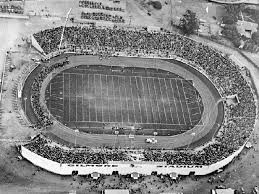 Aerial view with good view of midget car race track in Gilmore Stadium.