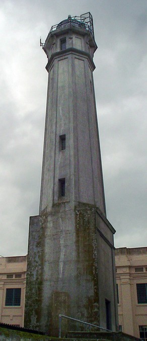 The lighthouse tower adjacent to the prison cell house. 

"Alcatraz Island Lighthouse Tower" by Centpacrr (Digital image), Licensed under CC BY-SA 3.0 via Wikipedia.