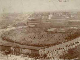 View of the field full of spectators - rope was the greatest barrier to spectators, so eager fans would sometimes close in on the field in a ring, as shown here. (Boston Public Library)