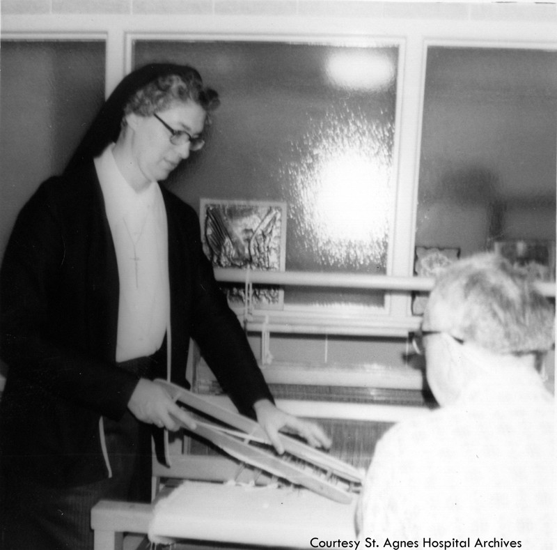 Sister Mary Christopher Esler with an occupational therapy patient at St. Agnes Hospital, 1970s.