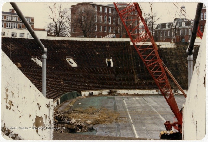 The original Mountaineer Field downtown's last game was held in 1979, but the stadium itself was not demolished until 1987.  West Virginia & Regional History Center.