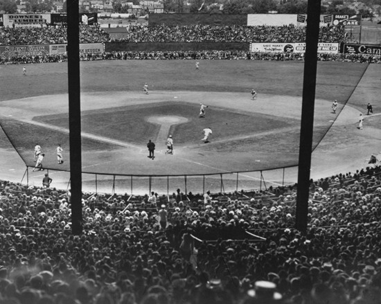 A view of the field from the stands during a game (Sourced from http://www.bu.edu/today/2012/braves-field-remembering-the-wigwam-2/, Boston Public Library)