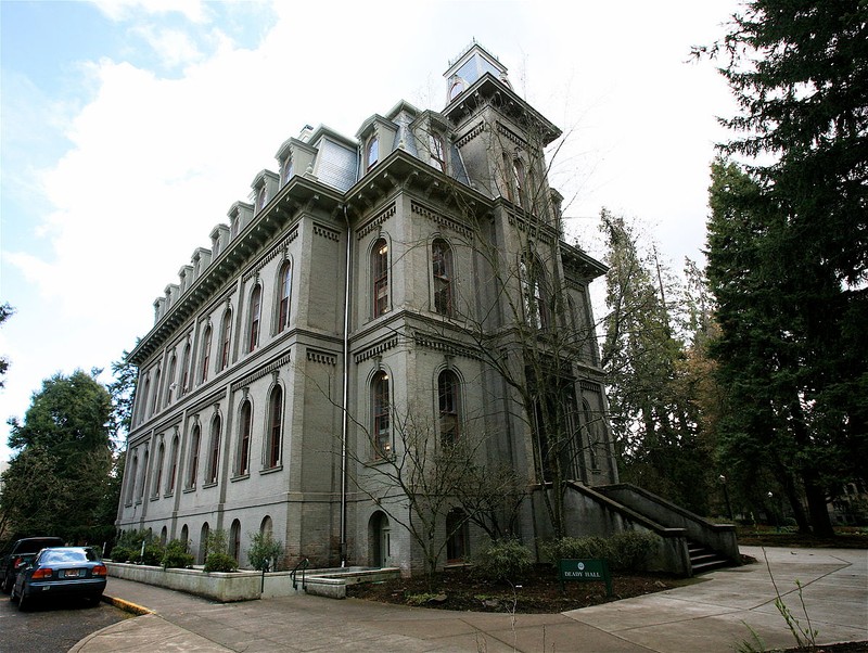 This three-story campus building features the Italianate style of architecture and an ornate a mansard roof.