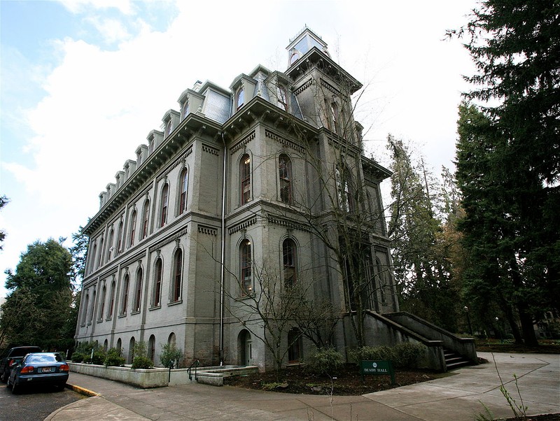 This three-story campus building features the Italianate style of architecture and an ornate a mansard roof. 