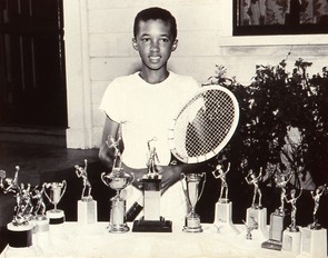 Ashe as a youth with his trophies