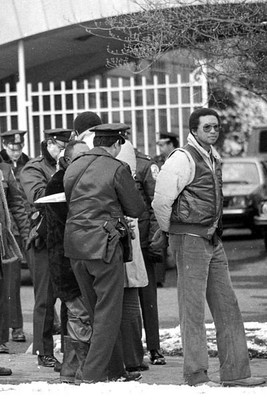 Arthur Ashe under arrest in 1985 after protesting in front of the South African Embassy 