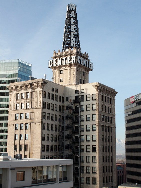 The Walker Bank Building was first constructed in 1912 and has since become Walker Center. The 'Walker Center' sign lights up the skyline, changing colors and sometimes flashing to warn onlookers about weather conditions.