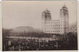 Crowds gather in temple square of the placing of the Angel Moroni capstone on highest pillar. April 6, 1892