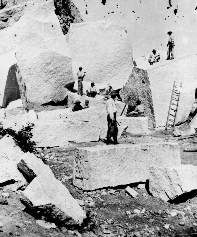 Stone cutters in at Little Cottonwood Canyon carve out granite for temple.  Canyon was 20 miles SW of the temple. Stone first hailed by oxcart then train starting 1871. 