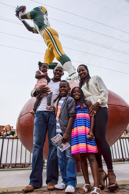 Former Packers wide receiver Donald Driver and his family stand in front of the newly unveiled state dedicated to him in 2013. Credit: Chris Rand