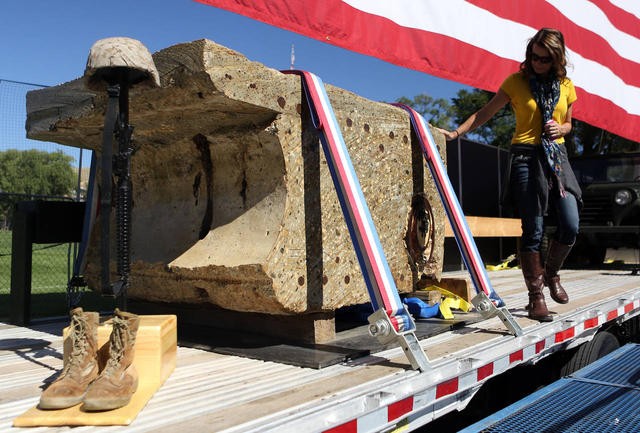 A piece of concrete from the World Trade Center arrives for the installation of the Memorial for Fallen Soldiers.