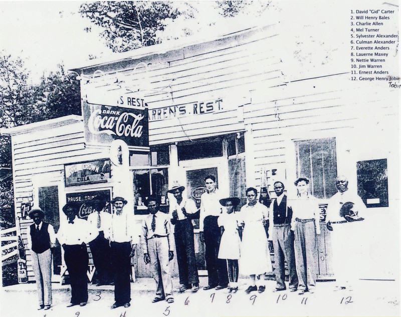 Residents of Coe Ridge in front of local business. 