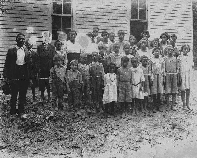 School children and their teacher at the Coe Ridge Colony. 