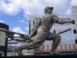 The statue of Josh Gibson is located just inside of the center field gate of Nationals Park.