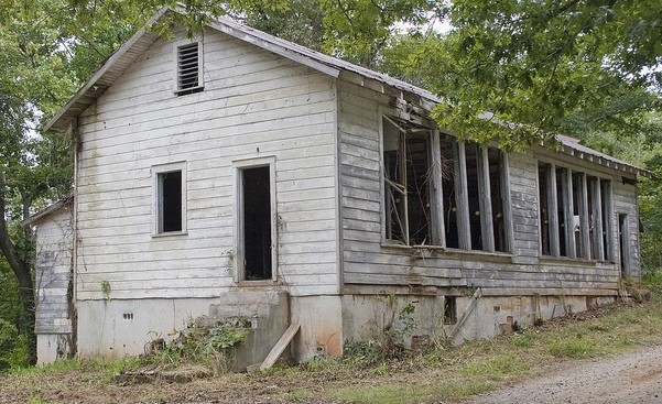 This rural school closed in 1964. Local community members are working to restore the school and operate a historic site at this location.