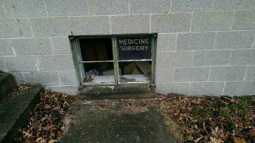 The lower window of  D.R. Hopson's medical practice located at 102 Bream street which shows what type of practice his facility performs .