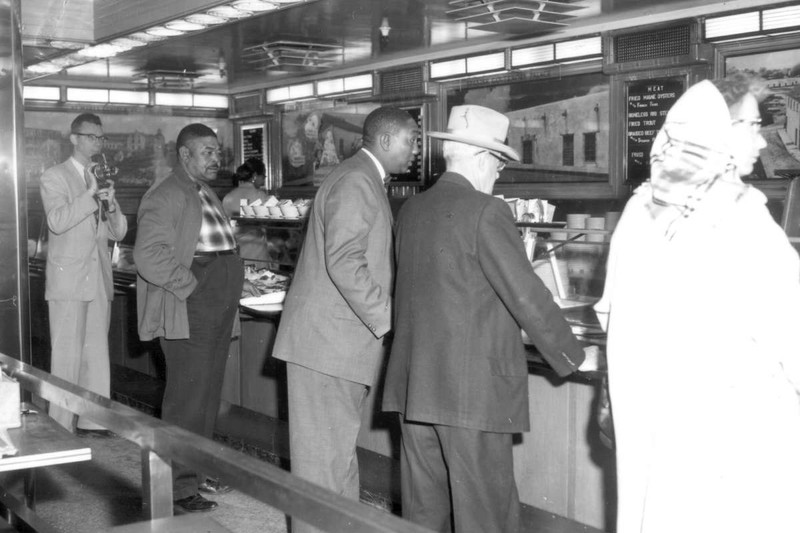 Men standing at counter - first day of integrated lunch counters