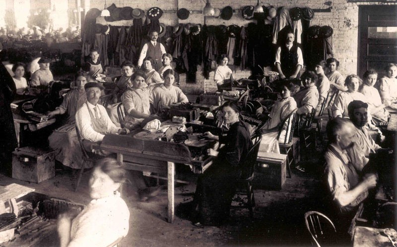 Interior view showing original cigar production workers.