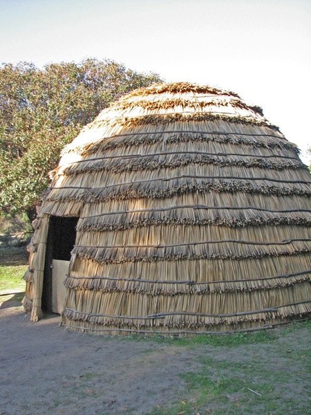 While the fort was being built, Sutter and his workers lived in tule reed houses, perhaps like this Chumash reconstruction at Mission La Purisima in Lompoc. (Flickr. Credit below).