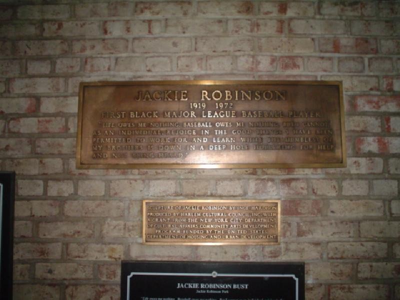 Two plaques can be found near the bust of Robinson and the entrance to the center