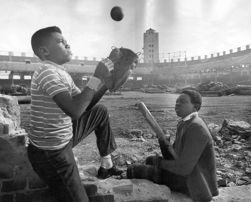 Two boys play during demolition of Wrigley Field in 1969.