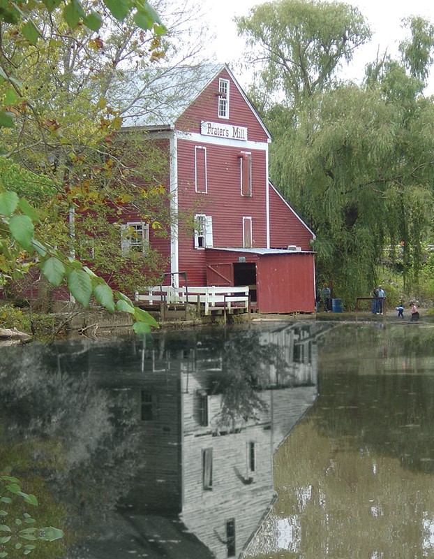 Prater's Mill before (reflection) and after the 42 years of restoration by the Prater's Mill Foundation.