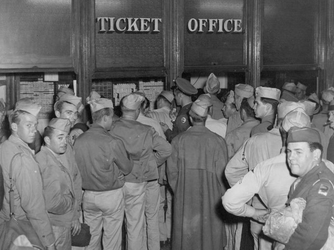 Soldiers on furlough buying tickets at Union Station during WWII