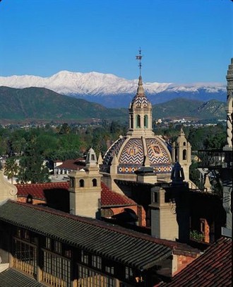 Mission Inn Hotel and Spa with Snow-Capped Mountains in the distance