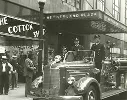 Firefighters pose outside of the Netherland Plaza. The hotel was damaged in a 1942 fire that resulted in the loss of its iconic chandelier.