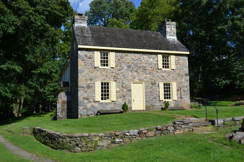 Exterior view of 2-story stone house